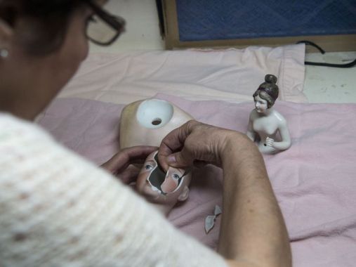 Doll restorer Ann Marie Carlson discovered her talent for art in her early 20s, when she studied painting, sculpting, colors, history. That led her to antiques and then to antique dolls. Nick Oza/The Republic